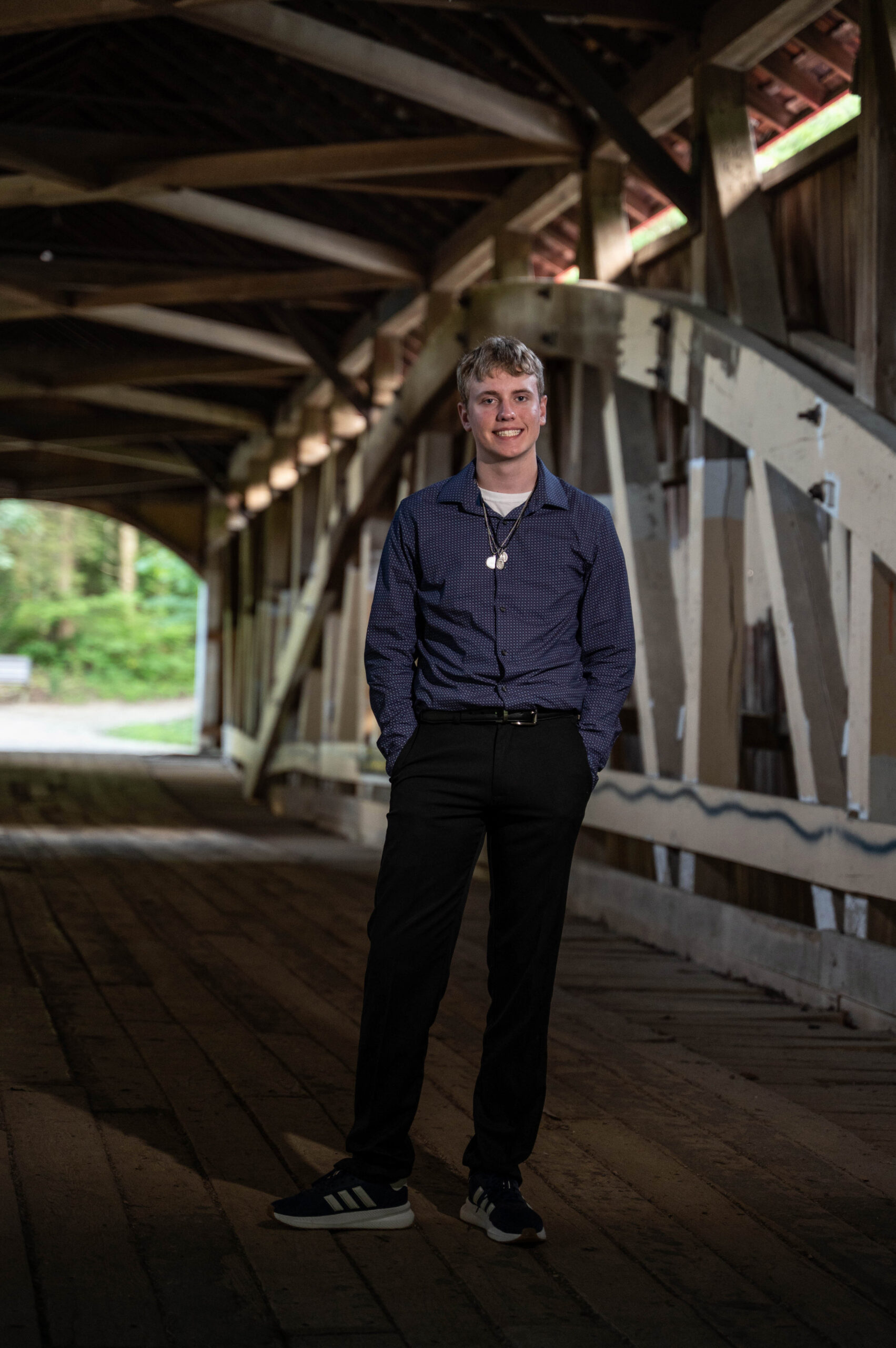 Clyde Fruits standing inside a covered bridge