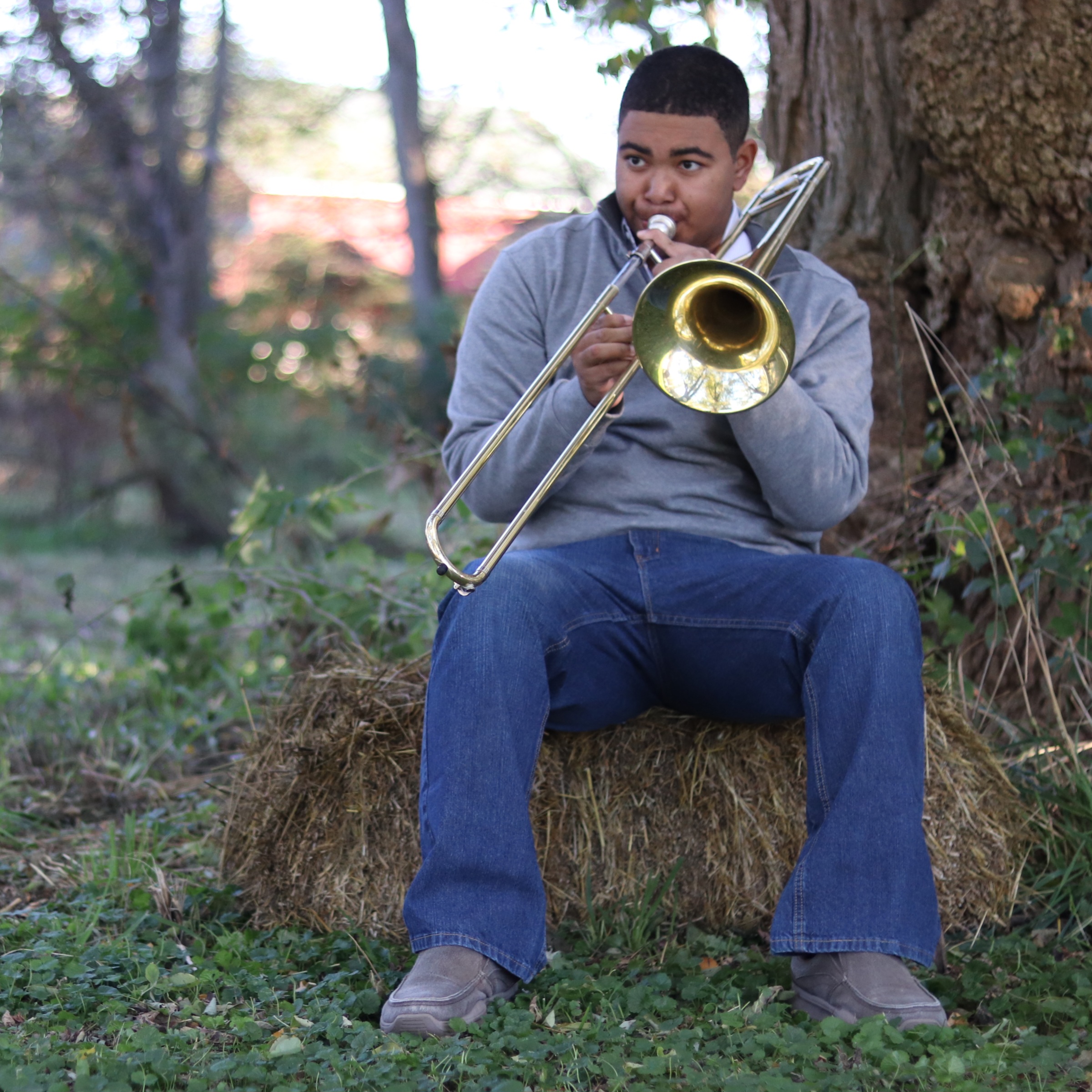 Tai Lin playing the trombone outdoors