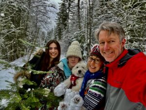 Kyah Lawe with her family outdoors in a snowy forest
