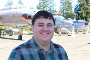 Portrait of Nathan Peterson outdoors near aircraft