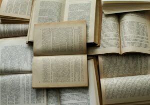 Open books in warm light, a stock photograph representing curiosity and learning.