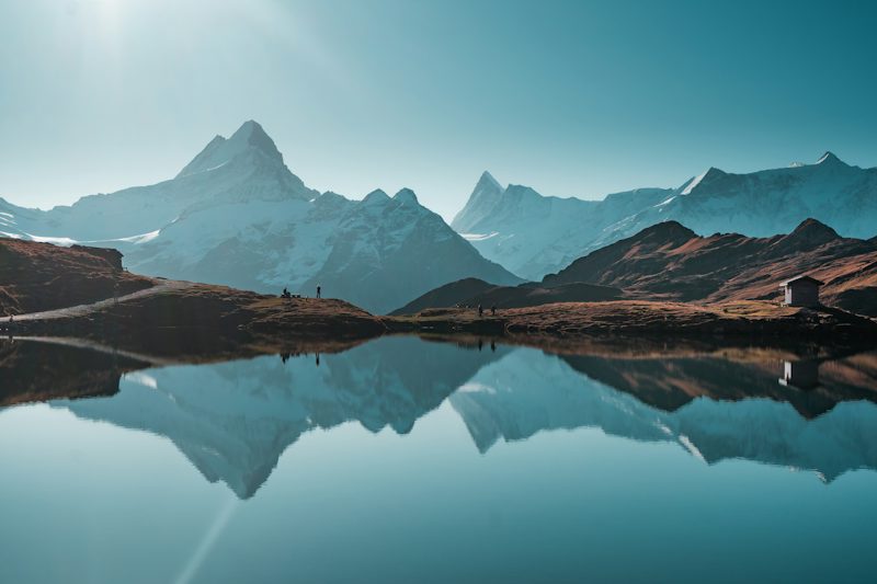 a mountain range with a lake in the foreground. Non-identifying stock photograph.